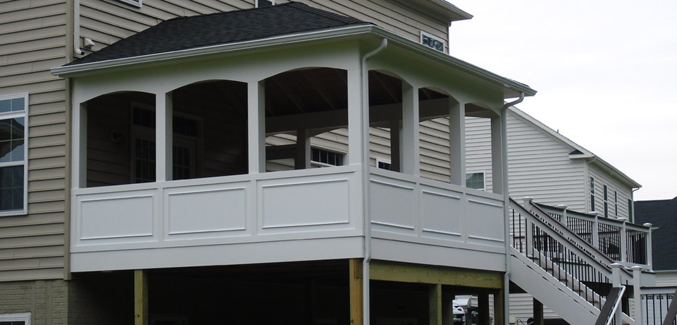 An Elevated Outdoor Deck With a Roof